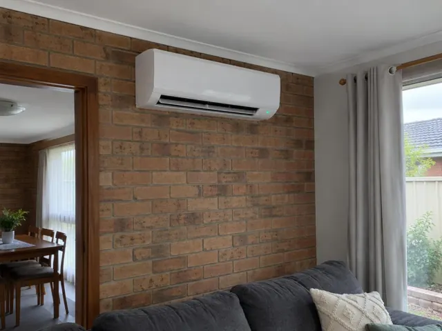 Split system indoor head running on a brick wall in a living room in Elizabeth Vale